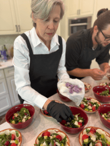 Ali garnishing the salad with flowers